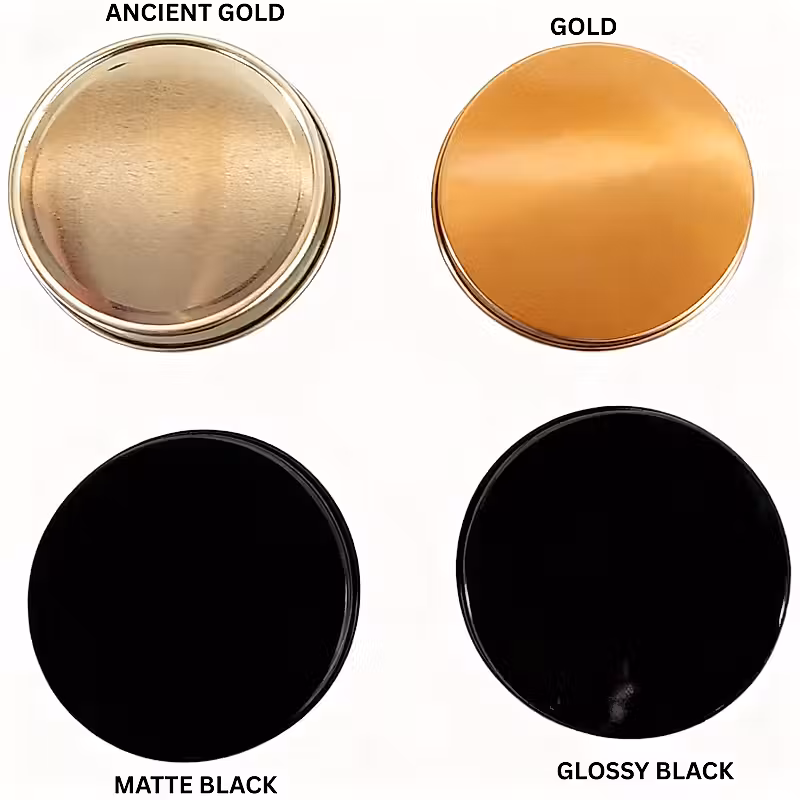 Four round lids are shown against a white background. The top left lid is silver, and the top right lid is copper. The bottom two lids are black.