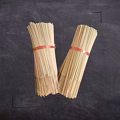 bamboo sticks wrapped in red tape on a blackboard