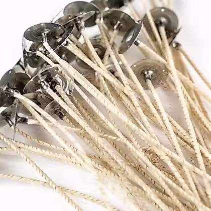 a close up of a bunch of metal pins on a white surface