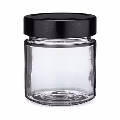 a glass jar with a black lid on a white background
