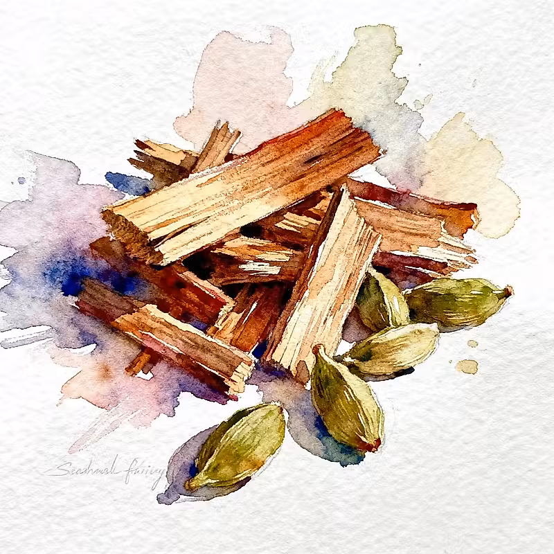 Copeaux de bois à côté de cinq graines de cardamome verte